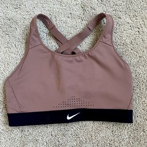 Women’s Nike size M dri fit sports bra cross back.